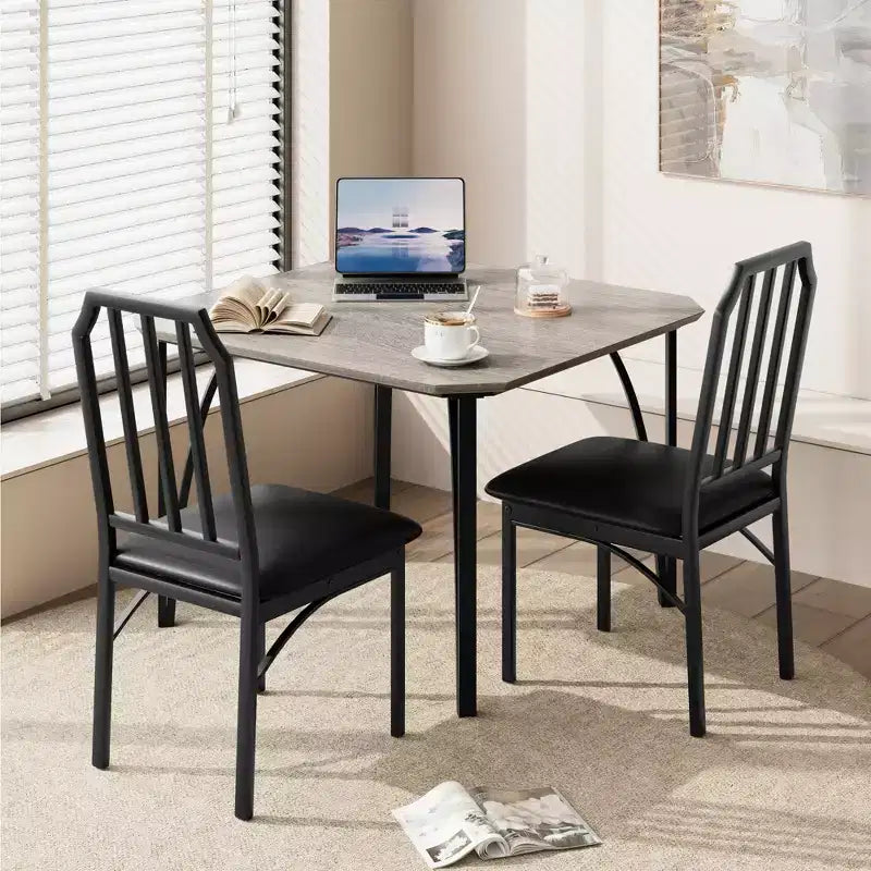 Compact dining table set with chamfered edges and upholstered chairs, perfect kitchen and dining furniture for small apartments and homes