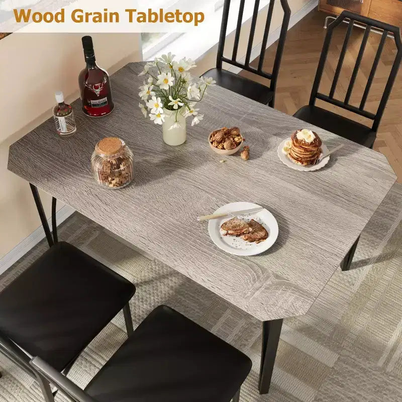 Set da pranzo compatto con bordi smussati e sedie imbottite, perfetto arredamento da cucina e sala da pranzo per piccoli appartamenti e case